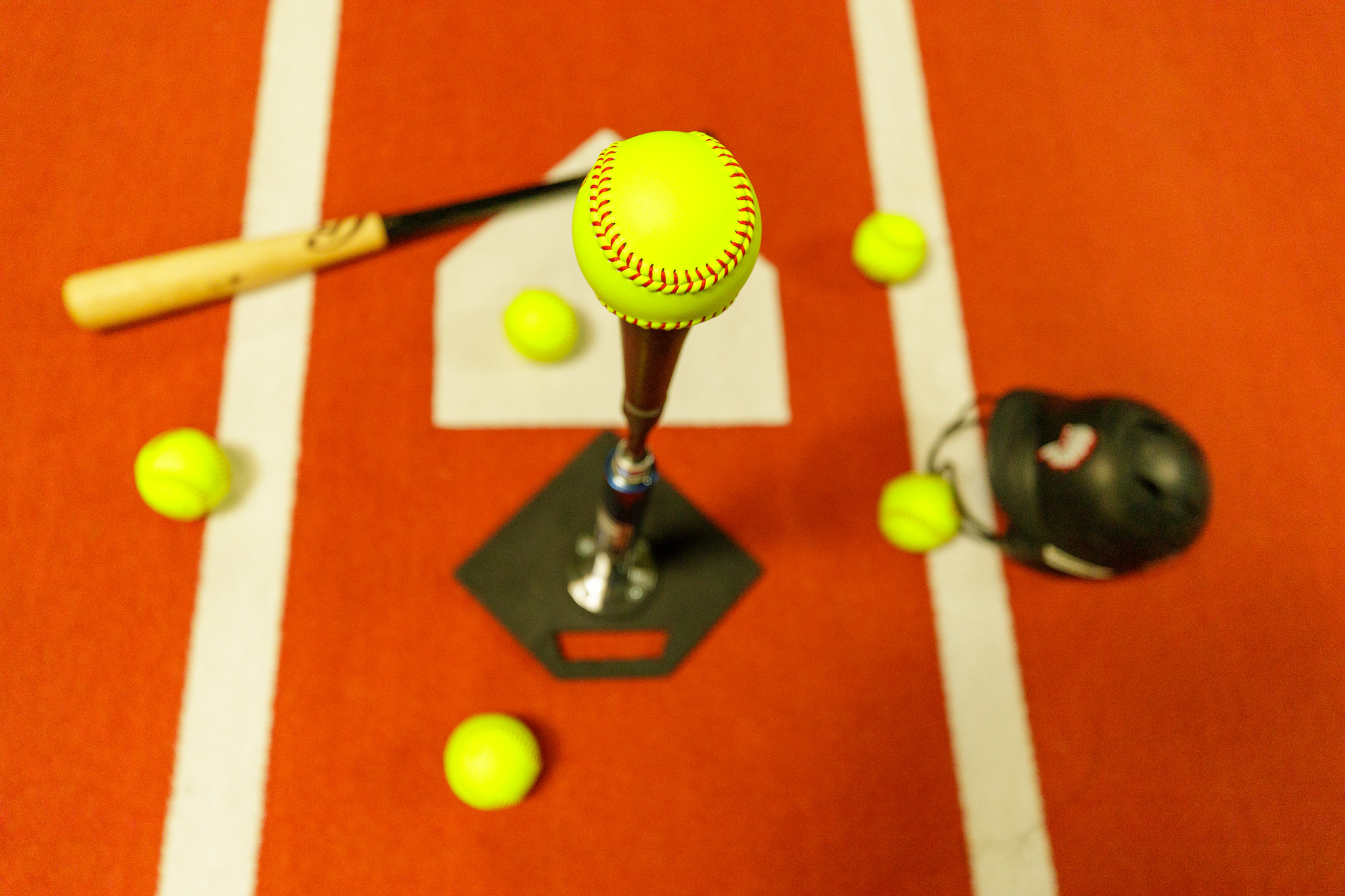 Softball on tee from above at home plate